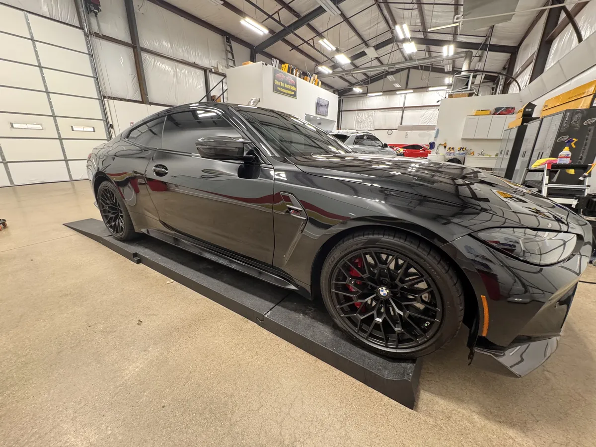 Black BMW M8 with full body paint protection film wrap at North Dallas installation center