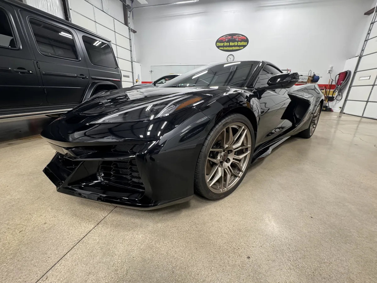 Black Corvette Z06 with full paint protection film installation at Clear Bra North Dallas shop