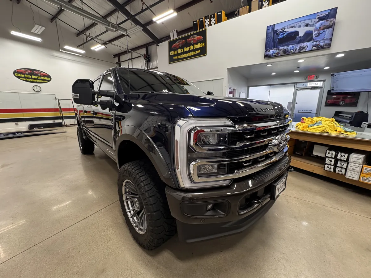 Black Ford F-350 Super Duty with paint protection film wrap at North Dallas facility