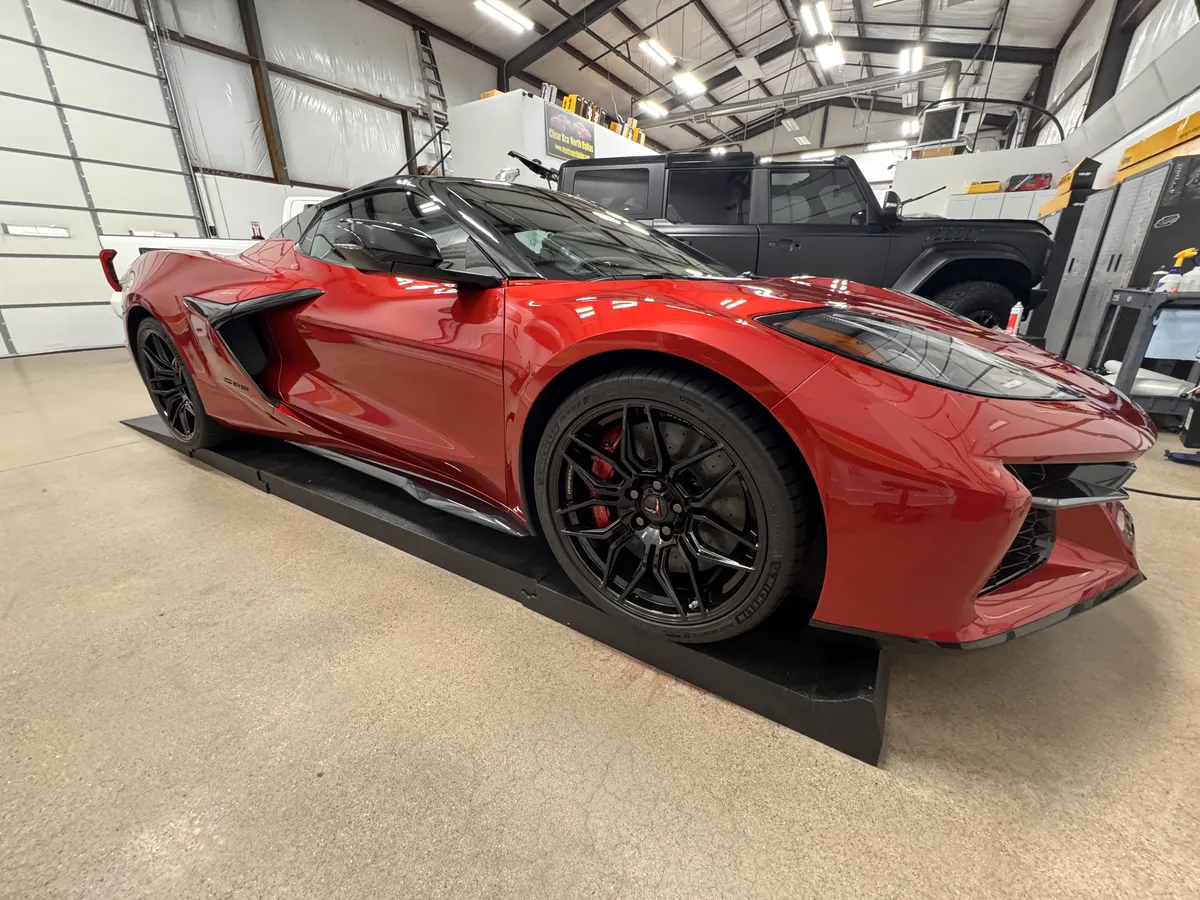Red Corvette C8 with full paint protection film wrap at Clear Bra North Dallas shop