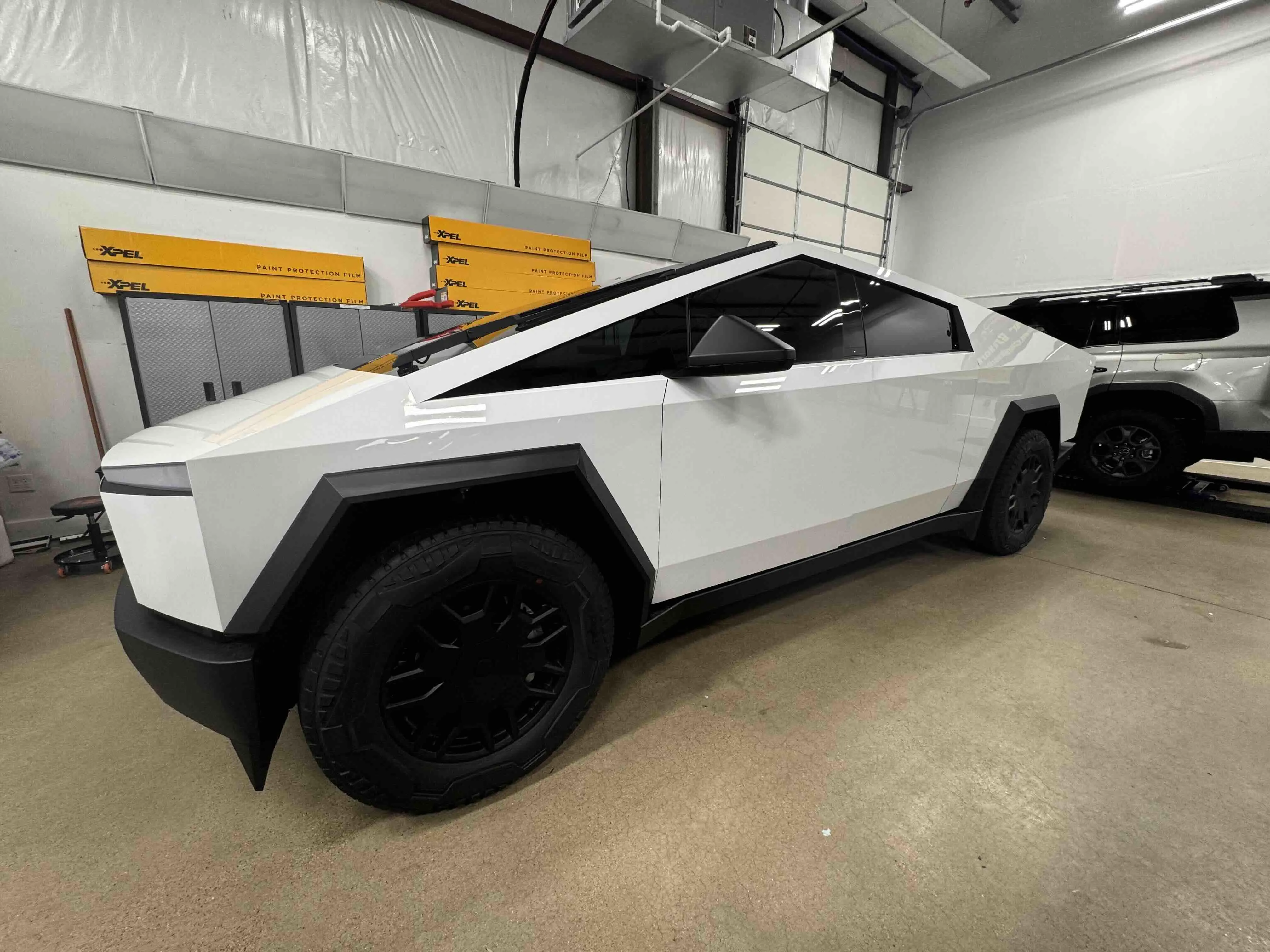 Tesla Cybertruck paint protection film applied to stainless steel panels